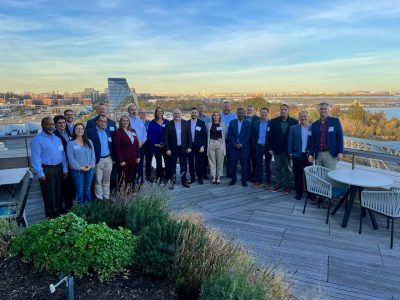 People stand on roof for group photo